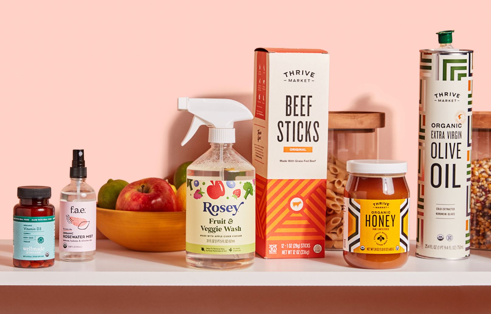 Thrive Market branded products sitting on shelves, including honey, beef jerky, and olive oil