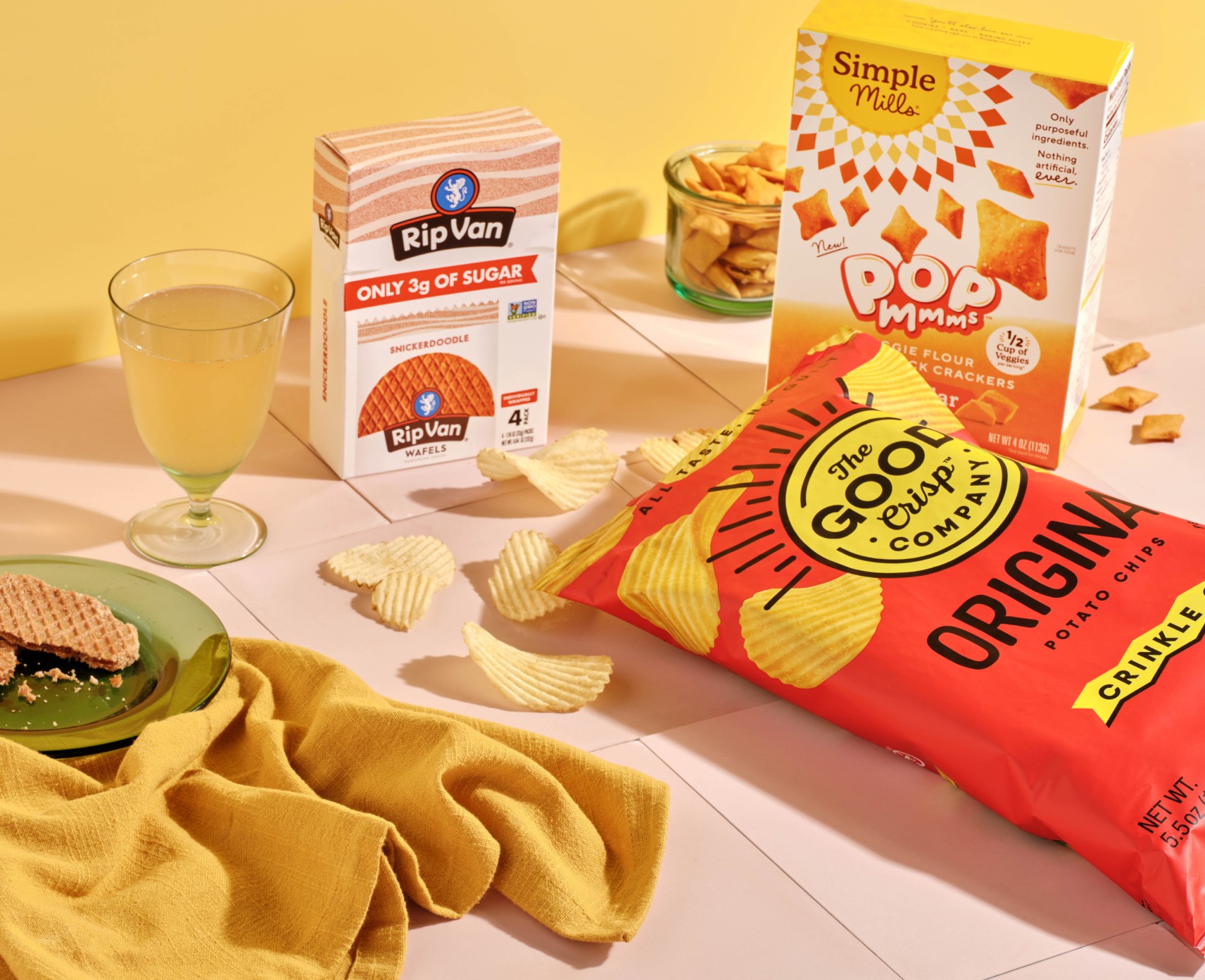 Thrive Market pantry products, including crackers and chips, arranged on a kitchen counter